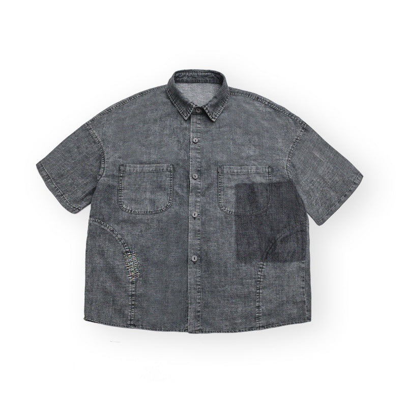 Washed and distressed loose short sleeved workwear denim shirt for men