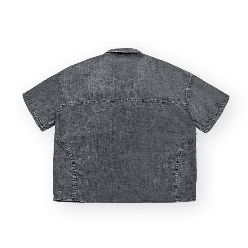 Washed and distressed loose short sleeved workwear denim shirt for men